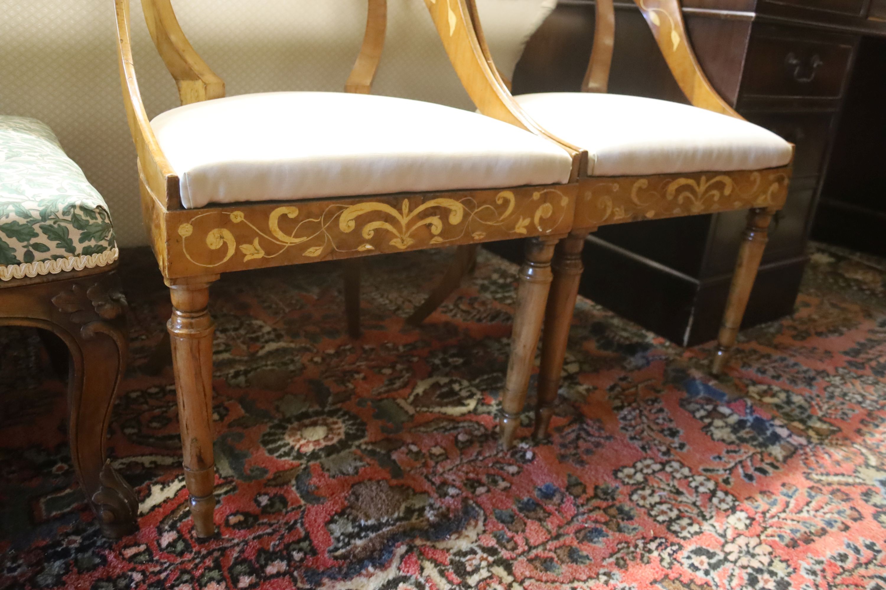 A pair of Italian walnut marquetry inlaid chairs, width 48cm, depth 40cm, height 90cm